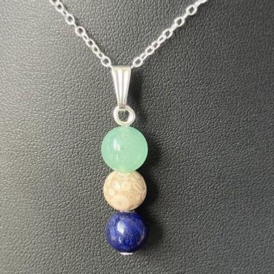 PEAU ET CHEVEUX PENDENTIF